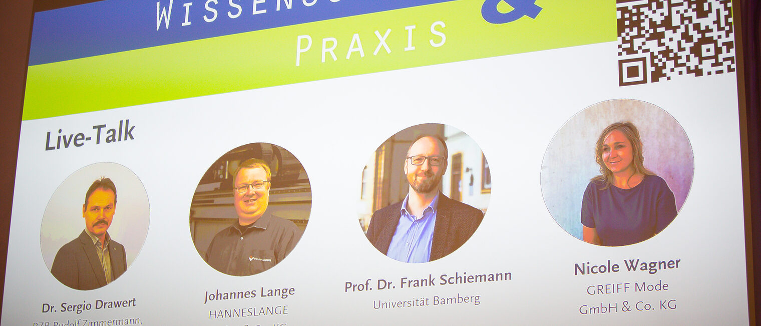 Präsentationsfolie mit den Gesichtern und Funktionen von Dr. Sergio Drawert, Johannes Lange, Professor Schiemann und Nicole Wagner