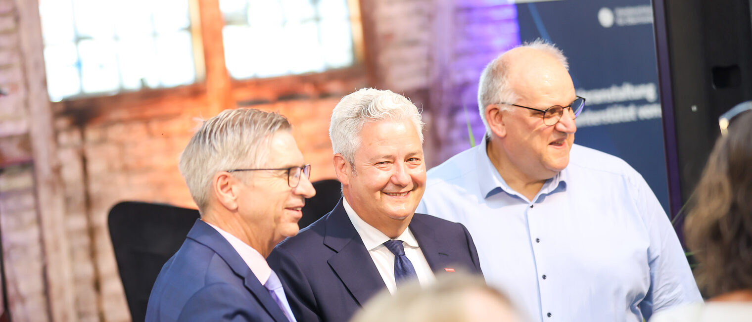 Michael Bissert, Matthias Graßmann und Reinhard Bauer stehen zusammen.