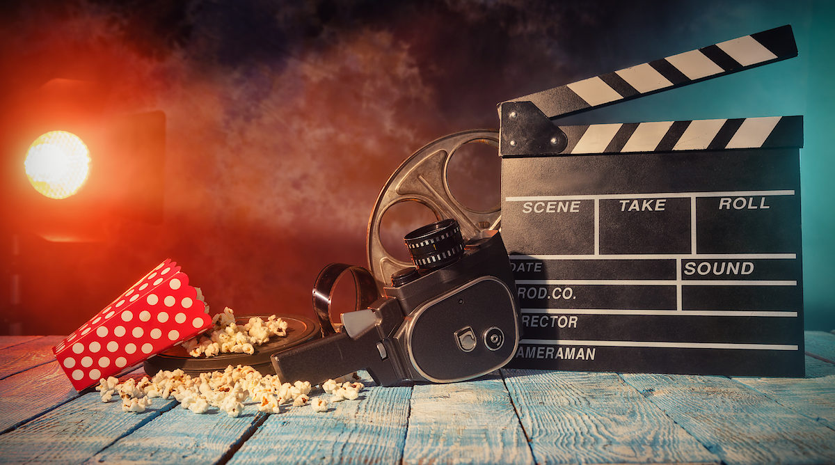 Retro film production accessories placed on wooden planks. Concept of film-making. Smoke effect with spot light on background Schlagwort(e): film, reel, movie, cinema, entertainment, motion, popcorn, picture, dark, black, wood, stilllife, retro, vintage, director, production, producer, background, studio, old, chalkboard, cinematography, clapper, filmstrip, industry, scene, shot, smoke, slate, effects, life, red, making, board, camera, celluloid, chalk, clap, clapboard, clapperboard, effect, roll, tape, video, hollywood, concept, theater, theatre, action, projector, film, reel, movie, cinema, entertainment, motion, popcorn, picture, dark, black, wood, stilllife, retro, vintage, director, production, producer, background, studio, old, chalkboard, cinematography, clapper, filmstrip, industry, scene, shot, smoke, slate, effects, life, red, making, board, camera, celluloid, chalk, clap, clapboard, clapperboard, effect, roll, tape, video, hollywood, concept, theater, theatre, action, projector